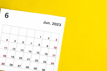 june calendar 2023 on a yellow background.