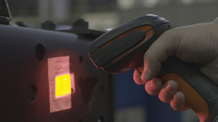 A man scanning a barcode, buying and selling concept. Scene. Close up of hand holding bar code...