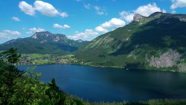 Stunning aerial panorama view of Altaussee lake  with the peaks Standling, Loser, Hochanger, Greimuth on a sunny summer day, Salzkammergut Ausseerland region, Styria, Austria