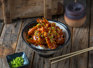 TENDON donburi served in a dish isolated on wooden background side view of japanese food