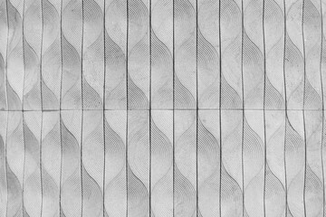 surface of textured tile  wall with embossed pattern as black and white colorless background	