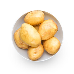 Pile raw potatoes in bowl isolated on white top view