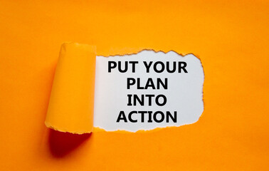 Put your plan into action symbol. Concept words Put your plan into action on white paper on a...