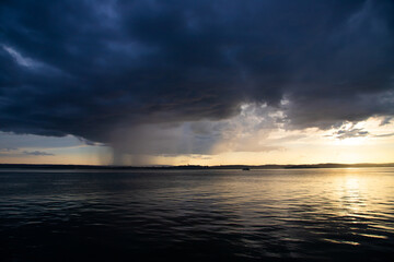 Heavy dark fast moving thunderstorm clouds over lake Constance, Germany