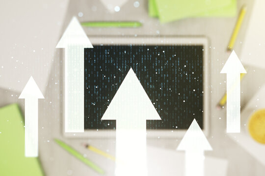 Creative abstract upward arrows hologram and modern digital tablet on desktop on background, top view, leadership and motivation concept. Multiexposure