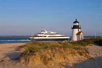 Ferry Passes By Lighthouse on Nantucket Island Off Cape Cod