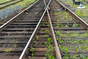 Railway and sleepers close-up. A major railway interchange near the station for train traffic, logistics between cities, cargo transportation.