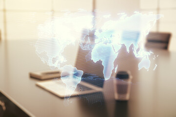 Abstract creative world map on modern laptop background, international trading concept. Multiexposure