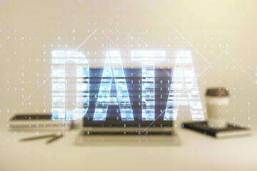Creative Data word hologram on modern laptop background, big data and blockchain concept. Multiexposure