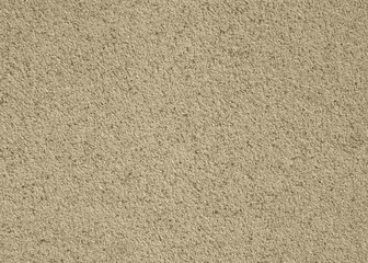 Abstract wall background. Beige plaster with mosaic pattern. Light surface with a chaotic loose pattern. Mosaic and granulated textured coating, texture, background