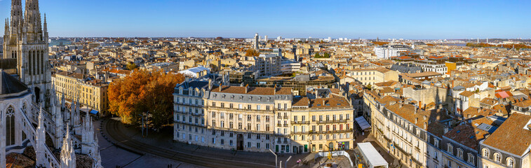 Fototapeta na wymiar Stunning panoramic aerial cityscape from Pey Berland tower of St. Andrew's Cathedral beautiful sunny evening of warm golden autumn, Bordeaux, Gironde, Nouvelle-Aquitaine, France.