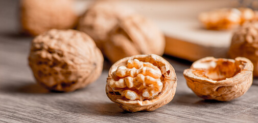 Walnuts kernels on wood desk with detail background,  walnut on wood kitchen underlay.