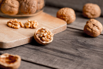 Healthy bio walnuts  on wood desk with detail background,  walnut on wood kitchen underlay.