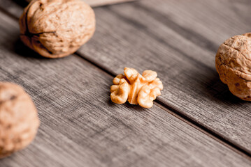 Walnuts kernels on wood desk with detail background,  walnut on wood kitchen underlay.