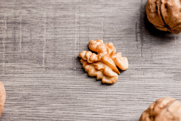 Walnuts kernels on wood desk with detail background,  walnut on wood kitchen underlay.