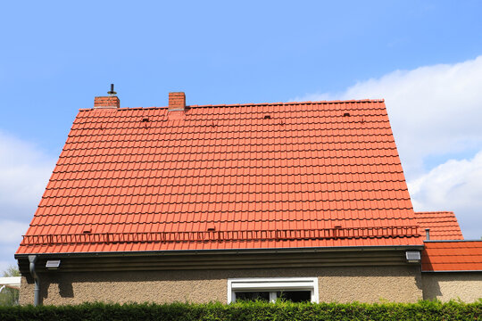 A roof with new red clay tiles
