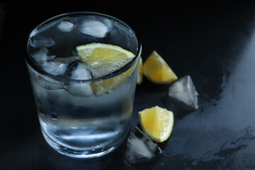Cold glass of water with lemon