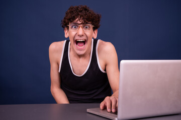 A man watches an adult video online.	