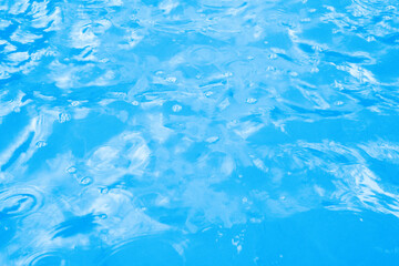 Water in swimming pool blue background
