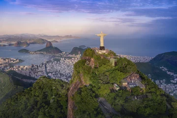 Fotobehang Aerial view of Rio with Corcovado Mountain, Sugarloaf Mountain and Guanabara Bay at sunset - Rio de Janeiro, Brazil © diegograndi
