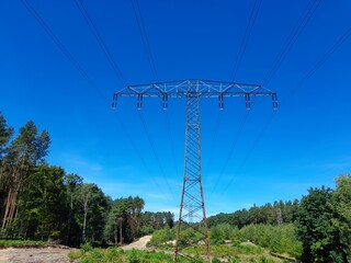 Obraz premium Power transmission pylons in federal state Brandenburg, Germany