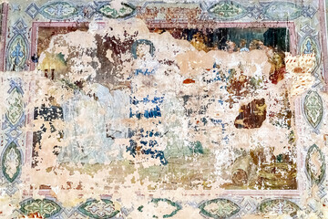pictures on the wall of an abandoned temple