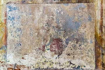 pictures on the wall of an abandoned temple