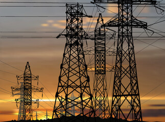 lectric towers group under sunset orange clouds