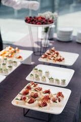Gourmet plate with delicious appetizer snacks in restaurants for banquet celebrations. Bruschetta with basturma