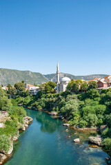 View  on Nerteva River and Old City of Mostar with Ottoman Mosque; Mostar in Bosnia and Herzegovina. 