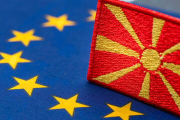 Flag of North Macedonia against the background of the Symbol of the European Union, Concept of...