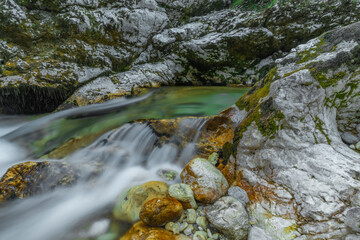Light blue water in Soca river in summer hot evening in Slovenia