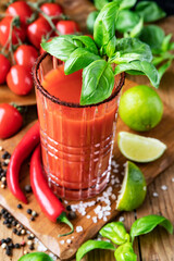 Drink Bloody Mary with peppers, lime and tomatoes