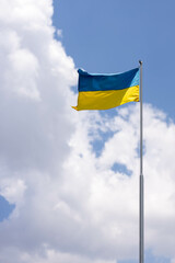 Ukraine flag large national symbol waving on the blue sky with clipping path. Large yellow blue Ukrainian state flag, Independence Constitution, National holiday. Democracy and politics. Symbol of win