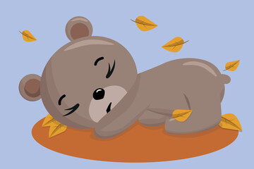 Cute little teddy bear sleeping in autumn foliage