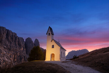 Incredible view on small iIlluminated chapel - Kapelle Ciapela on Gardena Pass, Italian Dolomites...