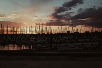 sunset at the port of la rochelle in france on the atlantic coast with beautiful light and lovely...