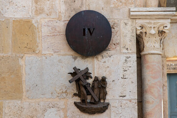 Station 4 of Via Dolorosa. Jesus carrying his own cross and meets Mary. Via Dolorosa street name indicator, East Jerusalem, Israel.