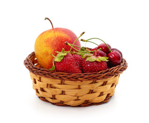 Fototapeta na wymiar Apple with strawberries and cherries in a basket.