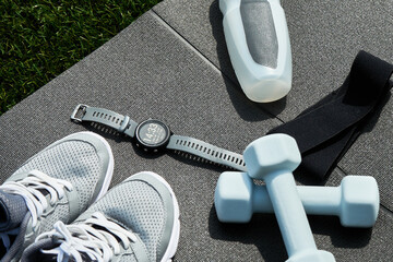 Sport items, fitness smart watches and running sneakers on gray background, Set of objects for...