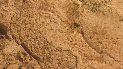 Top view of brown ground surface, close up natural background. Scene. Aerial for the dry soil under the sun.
