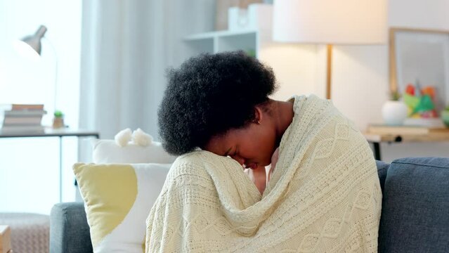 Depressed woman having a mental breakdown. Woman sick with the flu on a couch at home, suffering from covid fatigue. Lady feeling sad and guilty after an abortion, frustrated about a bad breakup