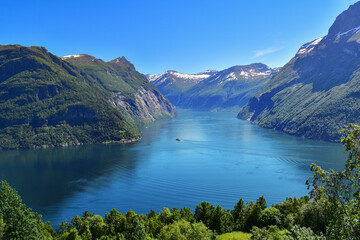 Naklejka na ściany i meble Cruise ship sailing mountains and ocean fjord landscape