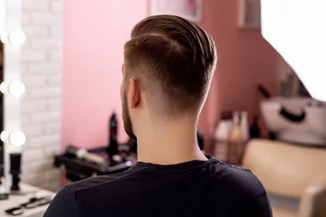 Foto op Plexiglas Male head with stylish haircut on barbershop background © Galina