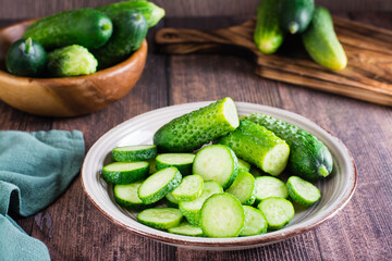 Fresh sliced cucumbers on a plate on the table. Dietary organic food.