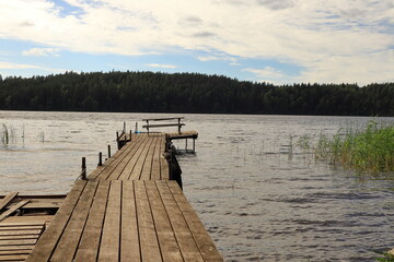 Wooden bridge. Long perspective view. Cloudy summer day. Empty with lot of space. M&auml;laren, Stockholm, Sweden, Scandinavia, Europe.