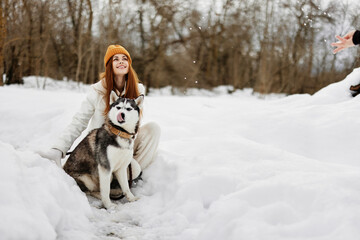 woman with a purebred dog winter landscape walk friendship winter holidays