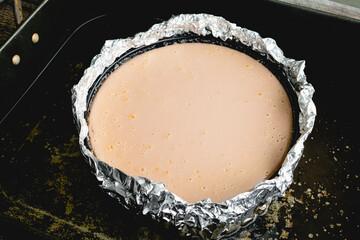 Baked Honey Lavender Cheesecake in a Water Bath: Baked cheesecake in a foil wrapped springform pan that's in a water bath