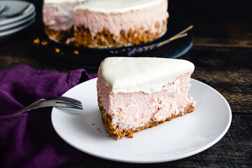 Slice of Honey Lavender Cheesecake Overhead View: Slice of pastel colored cheesecake on a plate with a fork