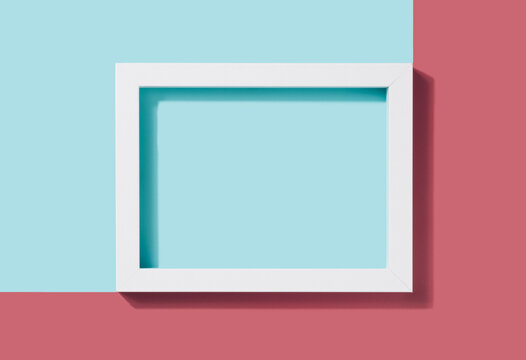 White rectangle frame on a two tone pastel background. Geometric minimal copy space.